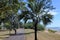 Unrecognizable person cycling along Nightcliff Beach Darwin Northern Territory of Australia