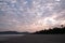 Unrecognizable person walking alone in a sunset on a beach in Costa Rica