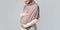Unrecognizable pregnant islamic woman in hijab touching her belly
