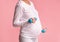 Unrecognizable Pregnant Woman Exercising With Dumbbells Standing , Studio Shot, Cropped