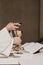 Unrecognizable Priest holding the goblet during a wedding ceremony nuptial mass. Religion concept