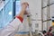 Unrecognizable researcher taking sample from a reactor in a laboratory.