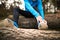 Unrecognizable runner sitting on wooden logs, man resting, stret