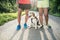 Unrecognizable senior runners with dog outside in sunny nature