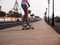 Unrecognizable skater woman going downhill outdoors