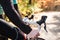 Unrecognizable sportsman riding his bicycle in sunny autumn natu