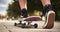 Unrecognizable teenager girl starting skateboarding on a road in a park - Wanderlust and skateboarder outdoor lifestyle concept