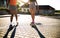 Unrecognizable teenager girls friends with skateboards outdoors in city.