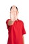 Unrecognizable teenager in red T-shirt showing gesture stop isolated on white background. Bullying concept. Closeup