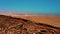 Unrecognizable tourists walk along edge of crater ridge. Spectacular aerial view preserved volcano Calderon Hondo on