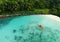 Unrecognizable Woman Canoeing in a Tropical Exotic Destination. Aerial Perspective of an Unrecognizable Tourist