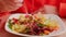 Unrecognizable woman eating thai salad with fork in restaurant. Food concept. Close up.