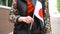 Unrecognizable woman holding Japanese flag. Girl walking down street with national flag of Japan