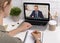 Unrecognizable woman using laptop computer in office for remote business meeting