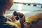 Unrecognizable Young Girl Standing On The Shore And Holding Binoculars. Scout Wanderlust Travel Concept