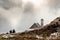 Unrecognized people hiking the trail to the church at Tre cime di lavadero. Italian Alps Italy