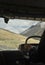 Unrecognized person driving passenger van (tempo traveller) in Manali-Leh highway with beautiful mountains view