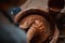 Unrecognized professional ceramicist making clay pot on pottery wheel in room indoors