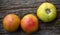 Unripe tomatoes on a rustic wooden background