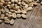 Unroasted green coffee beans on wooden background - Extreme clo