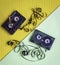Unrolled cassette tapes with pencil on colorful background