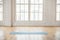 Unrolled yoga mat in empty fitness studio
