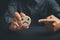 Unsatisfied customer holding frown icon on wooden circle