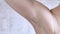 Unshaven armpit. Without hair removal and shaving. Natural female white body. Close-up. Self acceptance, untidy, body positive