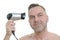 Unshaven man blow drying his short hair