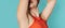 An unshaven young woman flaunting her unshaven armpits. Panoramic banner. Body positive young woman who decided not to