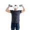 Unsportsmanlike middle-aged man wearing virtual reality glasses with dumbbells. Isolated on a white background