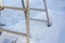 Unstable telescopic ladder on the snow