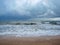 The unsurpassed beauty of the sea coast against the background of rain clouds during a thunderstorm.