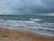 The unsurpassed beauty of the sea coast against the background of rain clouds during a thunderstorm.