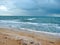 The unsurpassed beauty of the sea coast against the background of rain clouds during a thunderstorm.