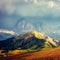 Unsurpassed sunset in the mountains. Scenic image of famous Sassolungo peak with overcast Dramatic sky. Wonderful Vall Gardena