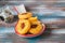 Unsweetened round cheese biscuits with herbs and almonds on a ceramic spoon on a wooden background. Savory cookie recipes as