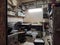 an untidy kitchen of a working bakery filled with ingredients and machinery