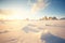 untouched snowfield bathed in golden light