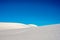 Untouched White Sand Dunes Under Bright Blue Sky