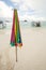 Unused beach umbrella on the beach