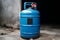 Unused blue LPG cylinder in a state of dormancy