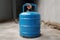 Unused blue LPG cylinder in a state of dormancy