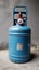 Unused blue LPG cylinder in a state of dormancy