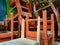 unused class chairs piled up in the warehouse