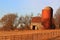 Unused farm buildings and silo sits empty