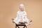 Unusual alien albino child sit in yoga pose isolated