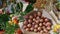 Unusual bouquet of potato tubers next to autumn agricultural fruits. Vegetable Farm Fair