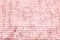 Unusual bright saturated abstract pink background from old brick wall
