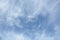 Unusual cirrus clouds in the blue sky. Beautiful sky background